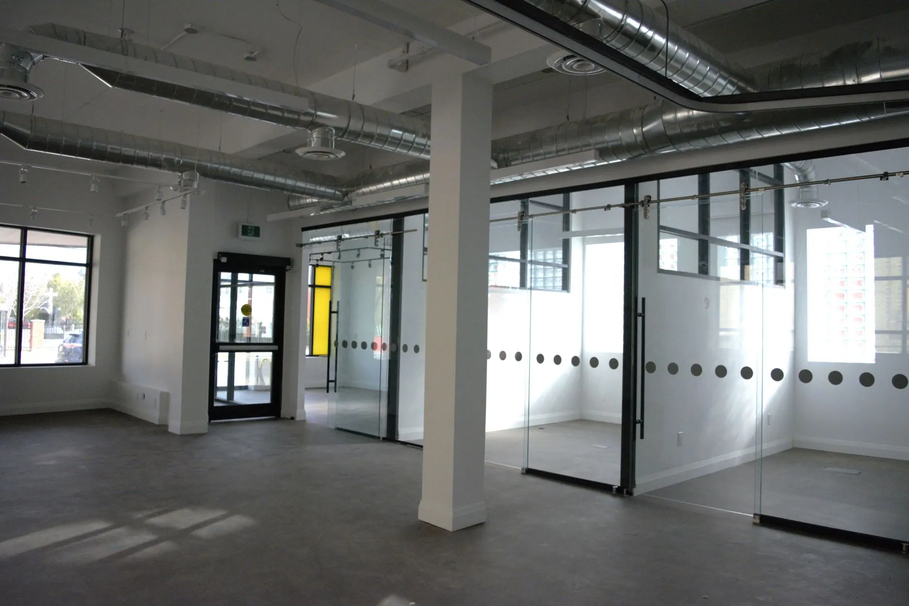 Completed glass-walled interior at Victoria Wellness